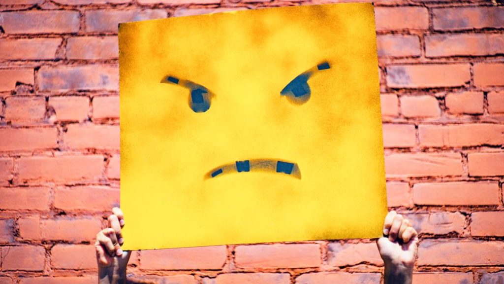 Mauer mit bösem Smiley